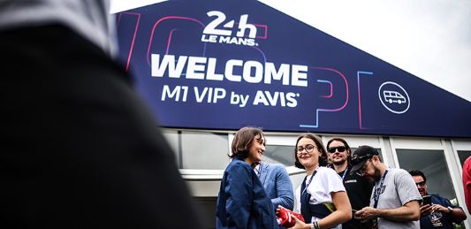 Spectators congregate outside the Avis VIP marquee at 24 hours of Le Mans, 2023