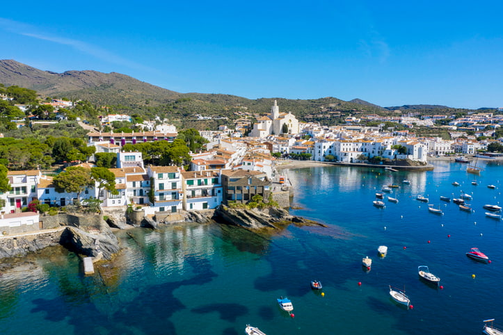 Fishing village with white painted houses and blue sea on the Spanish Costa Brava