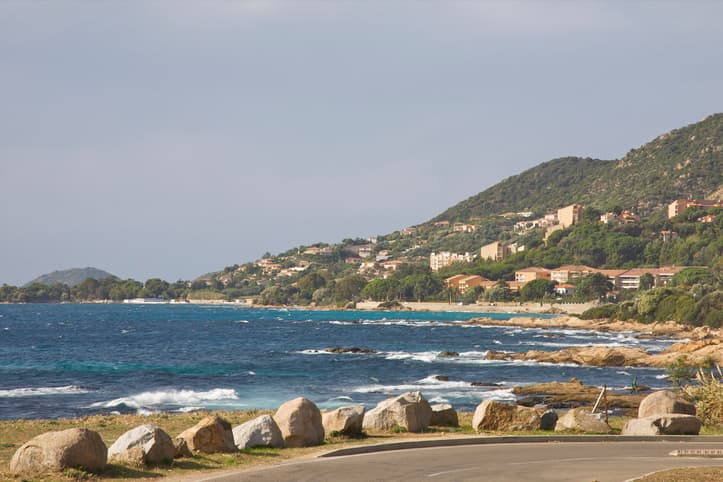 Road with beach and sea behind