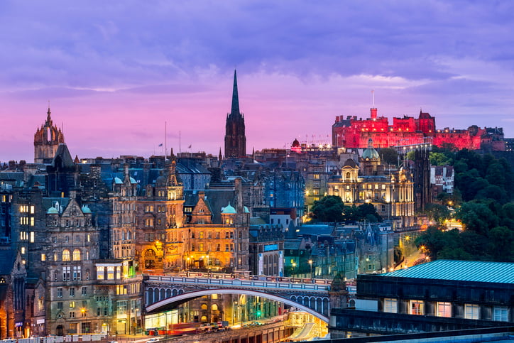 Edinburgh skyline from Calton Hill, granite stone buildings and pink sky