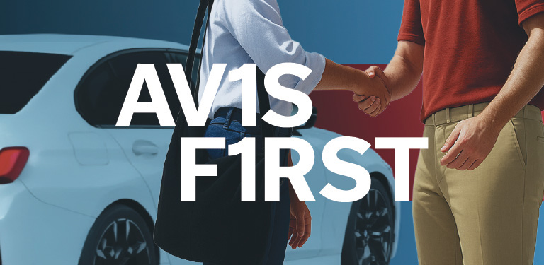 An Avis First customer greets an Avis concierge