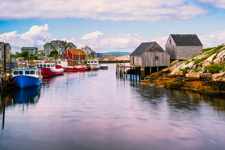 Peggys Cove near Halifax Nova Scotia picturesque scene with typical wooden houses and water with boats