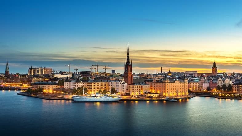 Skyline of Stockholm capital of Sweden showing outline of buildings with waterfront in foreground