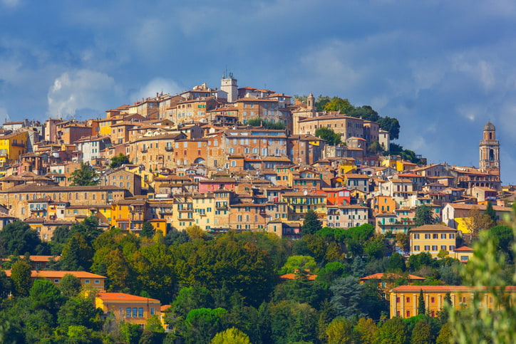 The medieval hilltop town of Perugia, Umbria, stone houses, terracotta roofs and blue sky