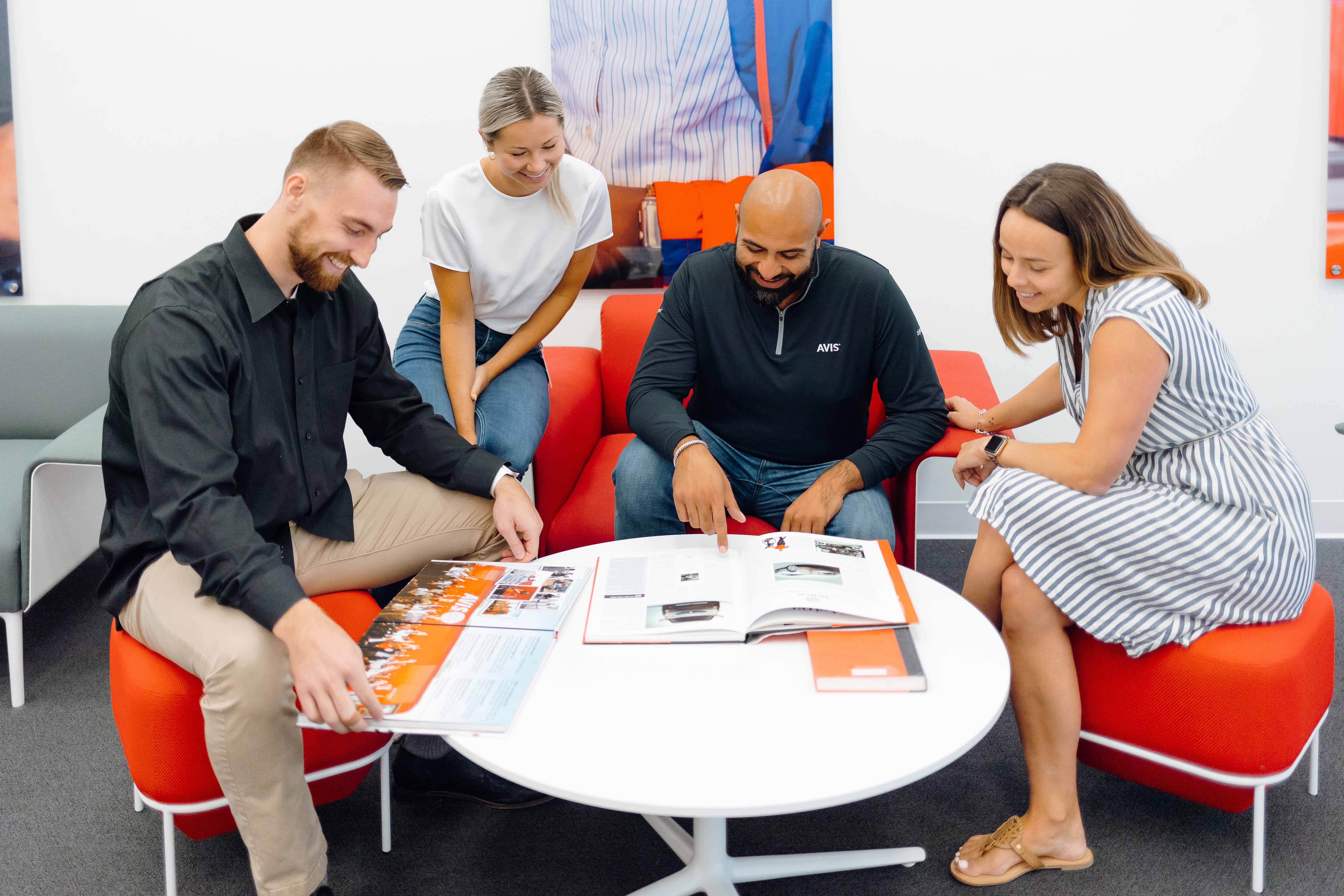 Avis office staff members review materials