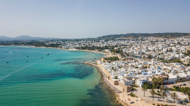 The coastal resort of Hammamet Tunisia with white buildings and azure blue Mediterranean Sea